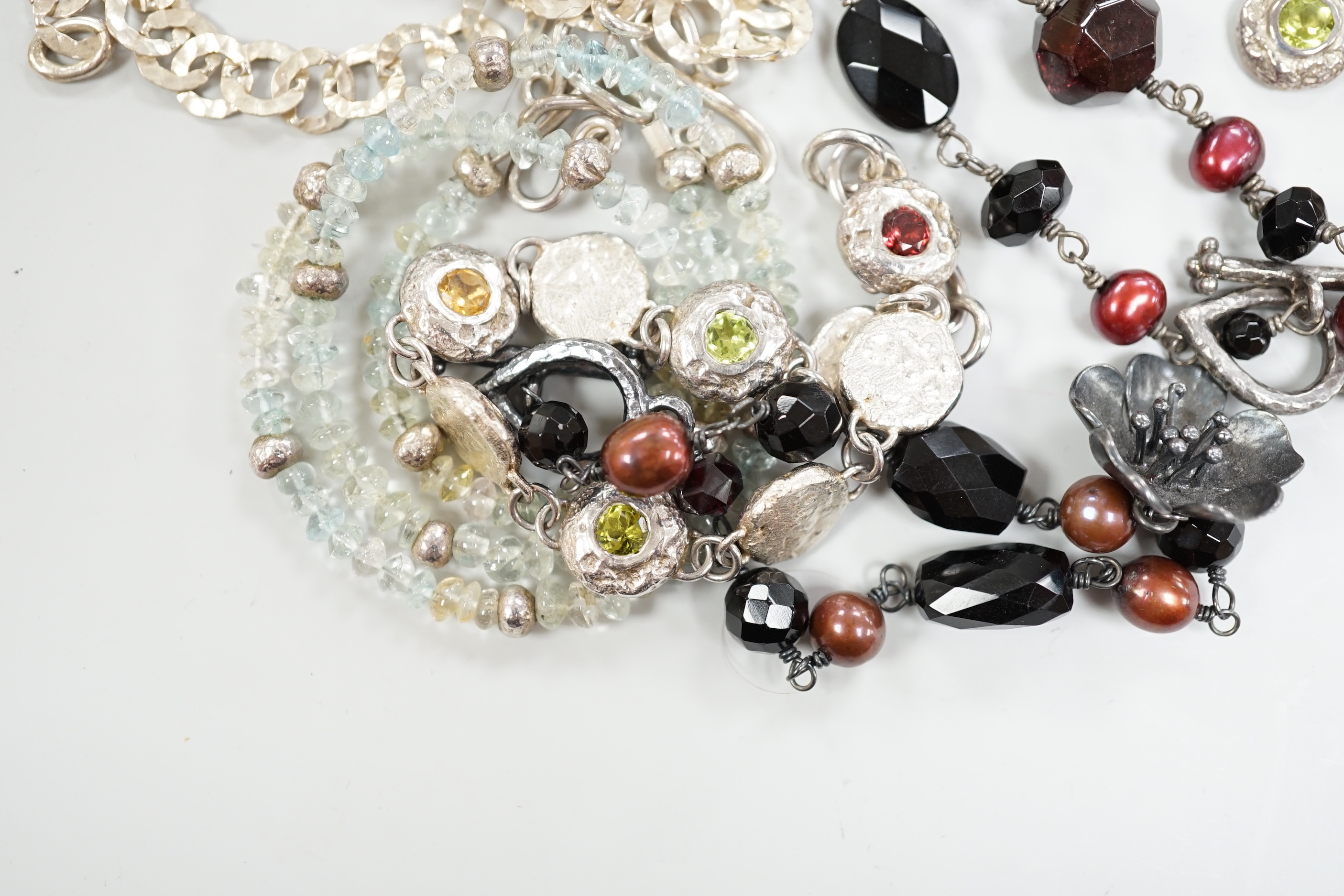 Two Pruden Smith silver necklaces and a similar bracelet, three other assorted silver necklaces and two silver bracelets, some with beads, largest 50cm.